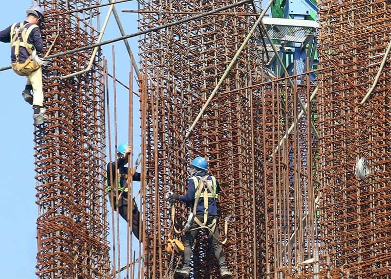 Workers continue to operate at a construction site in Santa Cruz, Manila on October 26, 2023.
