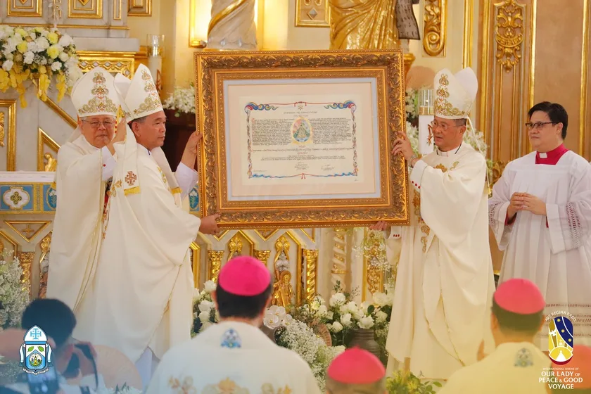 Bishop Ruperto Santos and Auxiliary Bishop Nolly Buco of the Roman Catholic Diocese of Antipolo present the Latin text of the Papal decree for the declaration of Antipolo Cathedral as an international shrine during the mass. Photo from the Roman Catholic Diocese of Antipolo FB Page