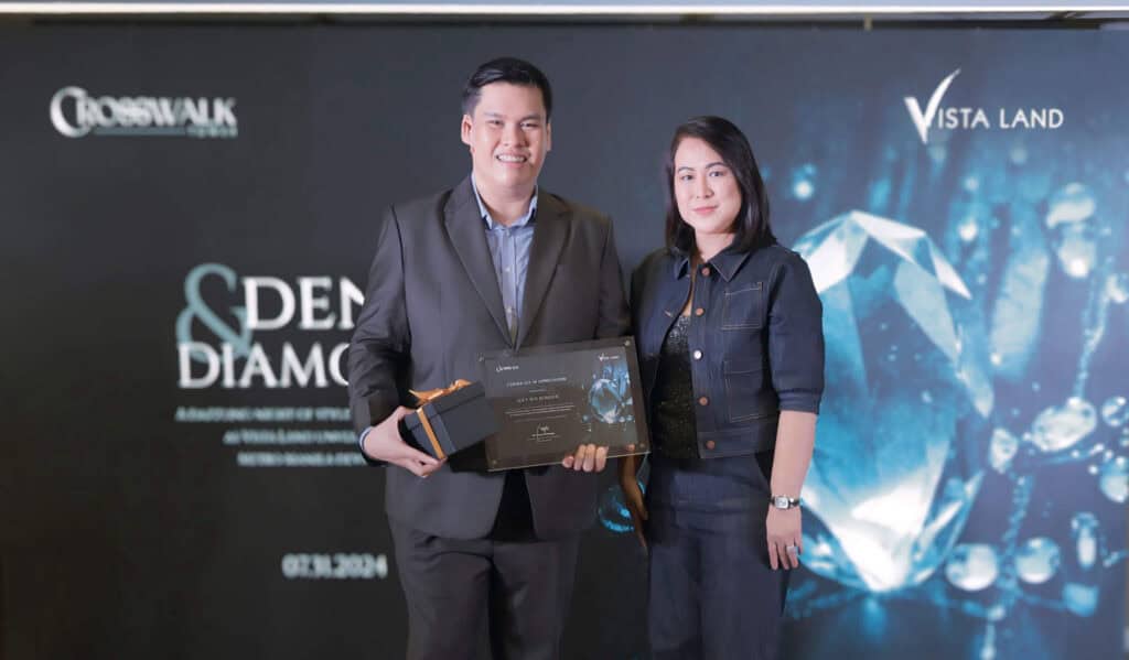 Vista Land High-Rise Development Division Head, Teresa Tumbaga, hands over a token of appreciation to guest speaker, Joey Roi Bondoc,  Colliers Philippines Director of Research.