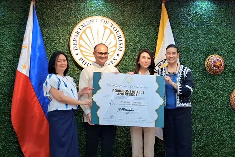 ROBINSONS HOTELS AND RESORTS (RHR) Senior Vice-President and Business Unit General Manager Barun Jolly (2nd from left) and Vice-President Annalyn Yap (Left) received the Muslim-friendly certification for all 22 of its properties from the Department of Tourism, led by Secretary Ma. Esperanza Christina G. Frasco (2nd from right).
