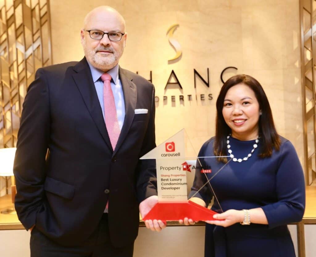   (L-R) Shang Properties executive director Wolfgang Krueger and executive vice president, commercial Maria Rochelle Diaz, receiving the award for Best Luxury Condominium Developer 
