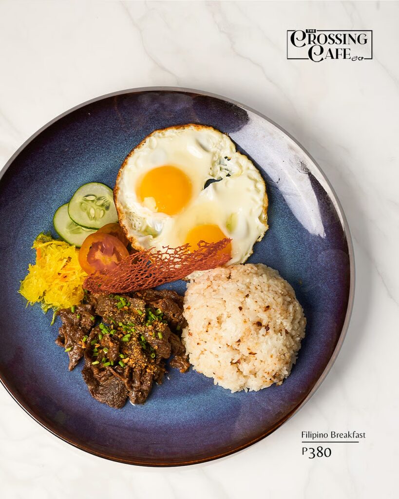 CLASSIC Filipino breakfast plate with marinated beef tapa, sinangag, sunny-side-up eggs.